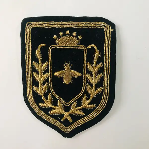 APLIQUE BORDADO TERCIOPELO ESCUDO MARCELO 75MM X 6UN